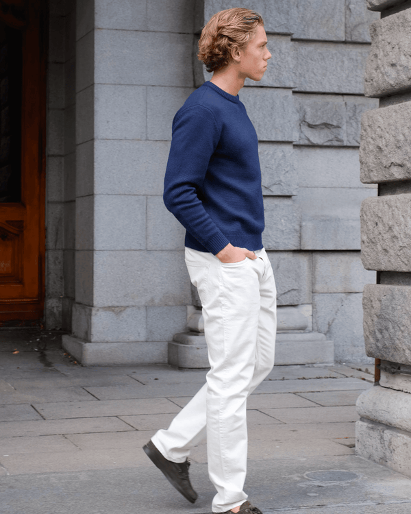 Navy sweater styled in a clean Scandinavian outfit