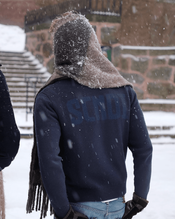 Close-up of navy knit fabric showing soft texture