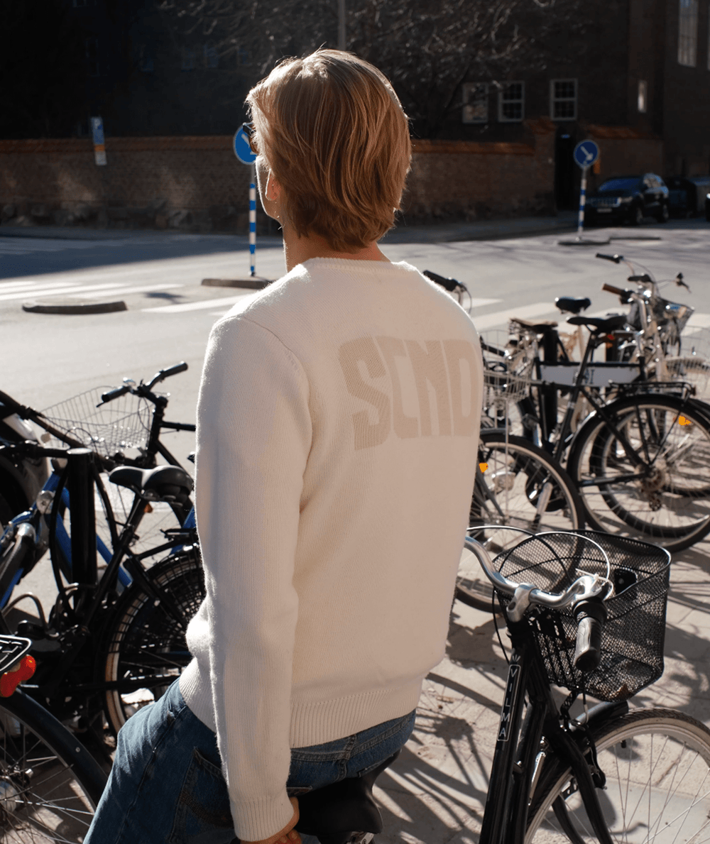 Ivory knit sweater with a minimalist Scandinavian design by SCNDI