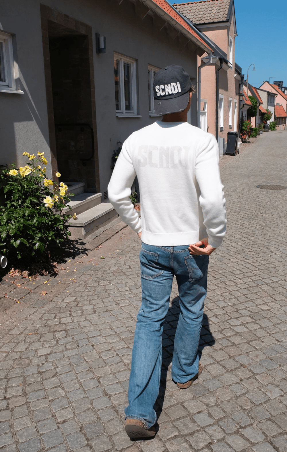Ivory knit sweater with a minimalist Scandinavian design by SCNDI
