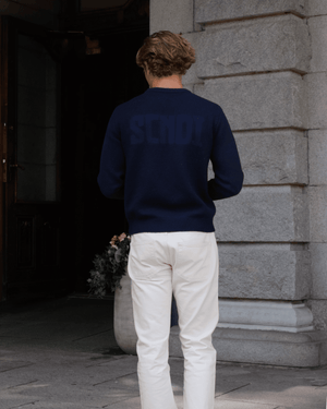 Front view of navy sweater with a clean, timeless silhouette